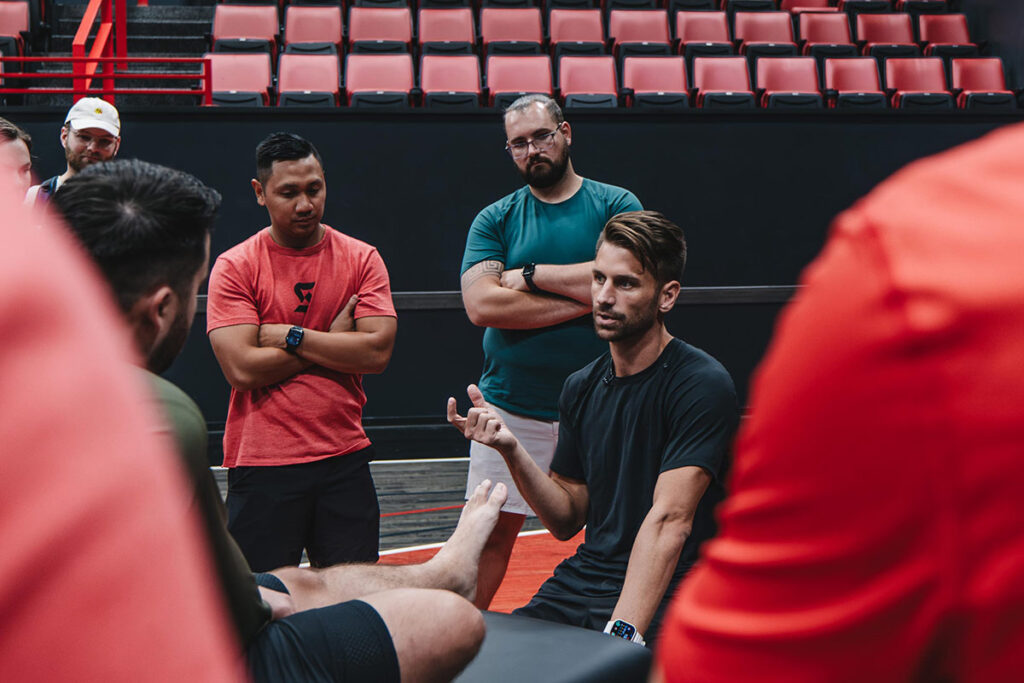 Adam talking with coaches and athletes